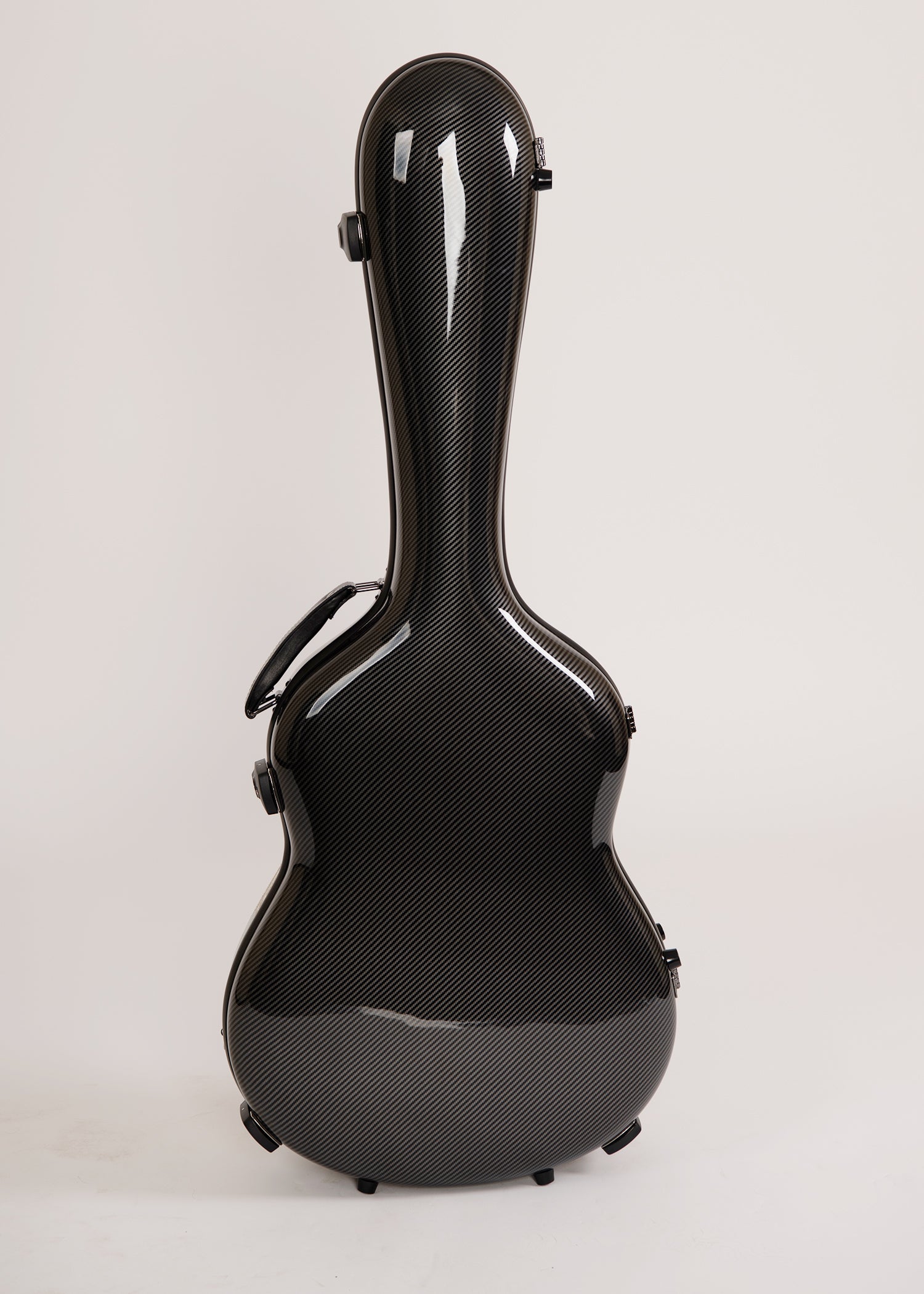 A glossy Alba GB black hard guitar case with a textured carbon-fiber, shown from the back against a light gray studio background.